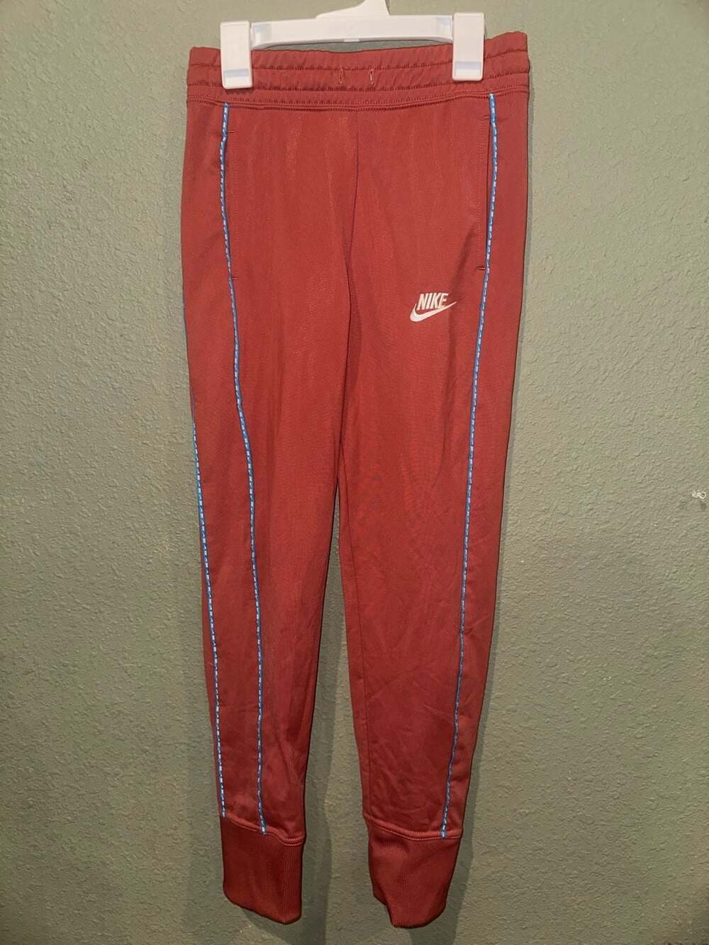 Nike Sportswear Taped Jogger Track Pants in Crimson Red with Blue Logo Side Stri